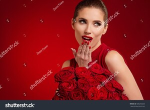 stock-photo-beautiful-surprised-woman-with-red-lips-posing-with-flowers-in-the-studio-on-a-valentines-day-580250203.jpg