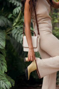 The-Wolf-Gang-Le-Jardin-Autumn-21-Estelle-Knit-Halter-Bone-Estelle-Knit-Pant-Bone-Layla-Mini-Box-Bag-Ivory-0151.png
