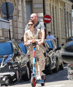 lily-collins-and-charlie-mcdowell-using-an-electric-sharing-scooter-in-paris-07-02-2022-3.jpg