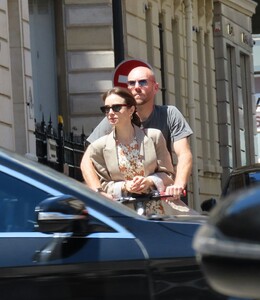 lily-collins-and-charlie-mcdowell-using-an-electric-sharing-scooter-in-paris-07-02-2022-4.jpg