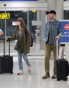 lily-collins-and-charlie-mcdowell-at-lax-airport-in-los-angeles-10-27-2022-5.jpg