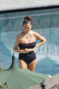 chrissy-teigen-in-swimsuit-at-a-swimming-pool-in-lake-como-09-14-2023-5.jpg