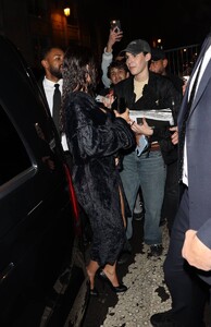 Kylie-Jenner---Weaing-a-black-skirt-and-bra-top-while-leaving-dinner-at-Costes-Hotel-in-Paris-08.jpg