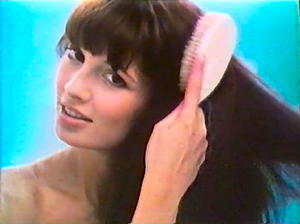 Class 9 Woman comb hair.png