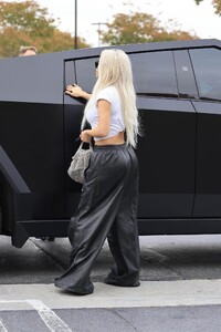 kim-kardashian-s-balenciaga-leather-pants-a-fashion-statement-at-kanye-west-s-son-s-basketball-game-1.jpg