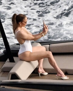 Jennifer-Lopez---Spotted-in-white-swimsuit-on-boat-in-Italy-04.jpg