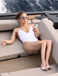 Jennifer-Lopez---Spotted-in-white-swimsuit-on-boat-in-Italy-13.jpg