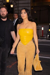 kim-kardashian-slays-in-miu-miu-pvc-top-coordinates-with-pet-pooch-sushi-0.jpg