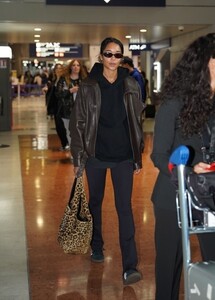 laura-harrier-and-fiance-sam-jarou-arrive-at-paris-cdg-airport-09-22-2024-2.jpg