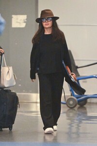 salma-hayek-radiates-chic-comfort-on-arrival-at-jfk-in-nyc-10-28-2024-0.jpg