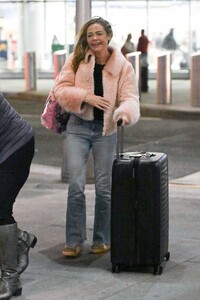 denise-richards-flaunts-smiles-at-jfk-10-17-2024-6.jpg