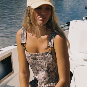 Camo_BeachOveralls_lifestyle_front_1.webp