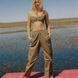 Khaki_CaitlynPant_lifestyle_front_1.webp
