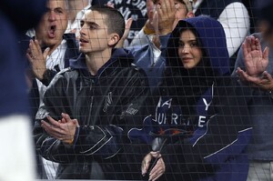 kylie-jenner-dons-marty-supreme-hoodie-at-yankees-alds-game-1.jpg