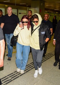 camila-mendes-at-sao-paulo-airport-in-yellow-hoodie-december-2025-0.jpg