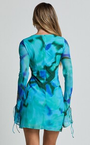 EVenz - Showpo - Alesya_Mini_Dress_-_Ruffle_Plunge_Neck_Long_Sleeve_Tie_Detail_Dress_in_Blue_Floral_Print_0008.jpg