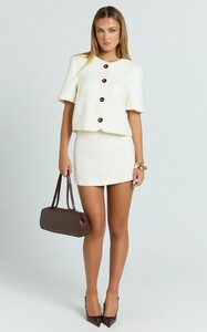 YasminC - Showpo - Halsey_Mini_Skirt_-_Tailored_A_Line_Skirt_in_Cream_1.jpg