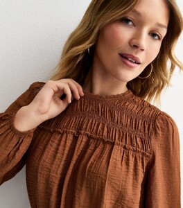 dark-brown-shirred-crew-neck-blouse.jpg